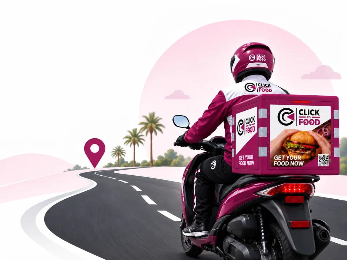 A Click To Food rider on a branded scooter riding toward the Dubai skyline